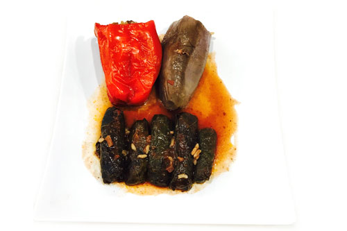 Stuffed eggplant, red bell peppers & grape leaves.